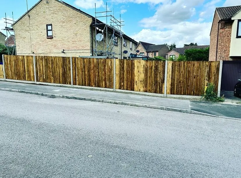 Garden fencing project completed behind a house