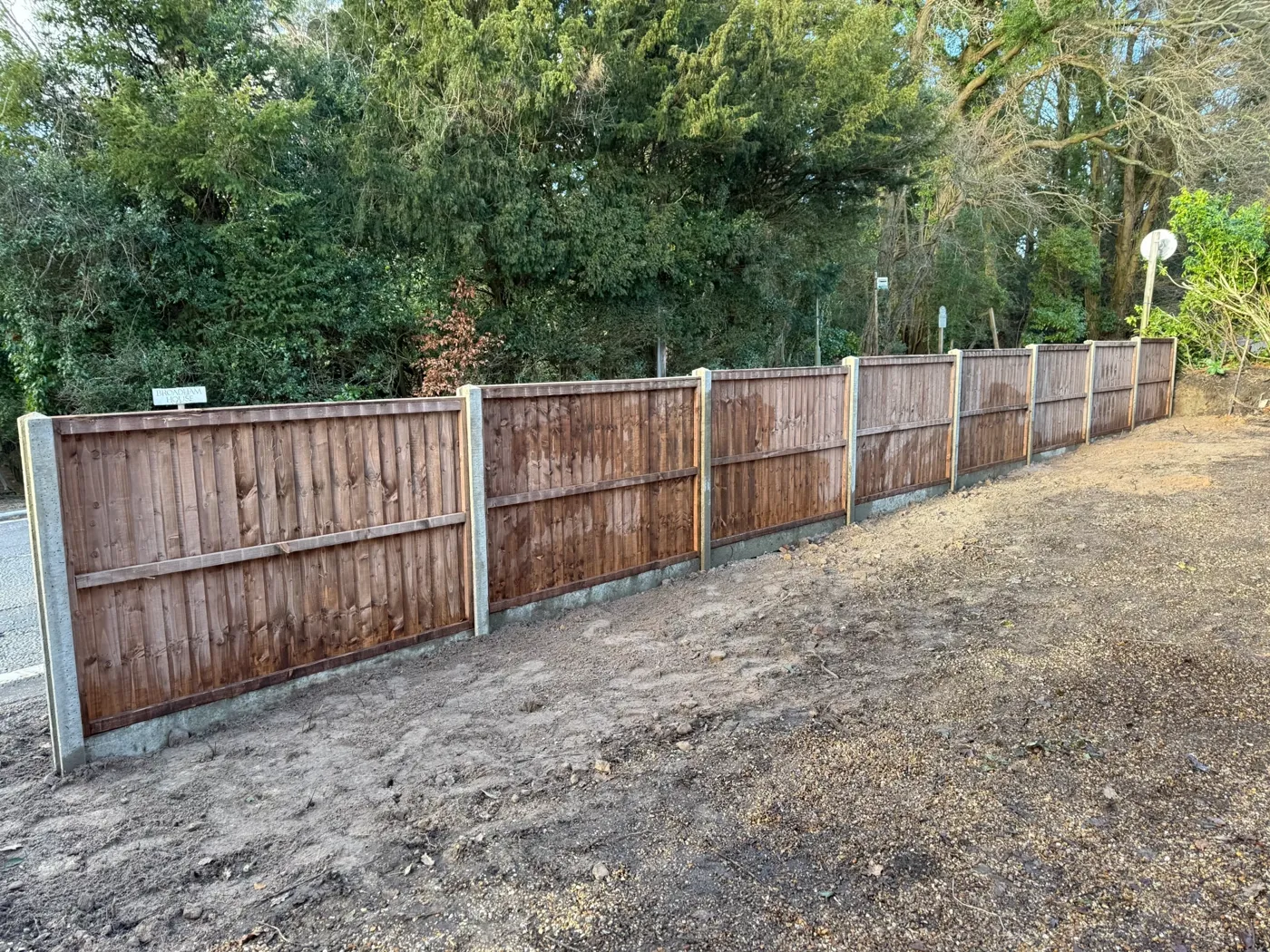 Completed timber fencing project on a garden boundary