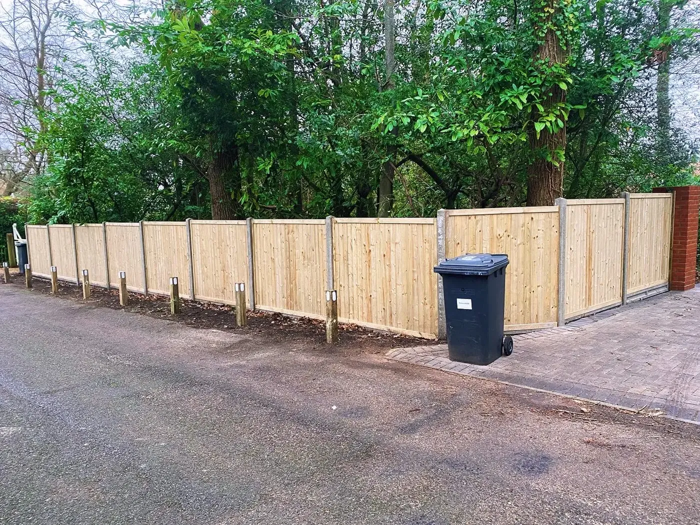 Closeboard fence installation completed in a residential garden